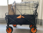 An Elastic Cargo Net measuring 47" × 35", equipped with 12 hooks. It's used to secure cargo on the wagon, ensuring safety and stability during transportation.