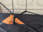 An Elastic Cargo Net measuring 47" × 35", equipped with 12 hooks. It's used to secure cargo on the wagon, ensuring safety and stability during transportation.