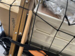An Elastic Cargo Net measuring 47" × 35", equipped with 12 hooks. It's used to secure cargo on the wagon, ensuring safety and stability during transportation.